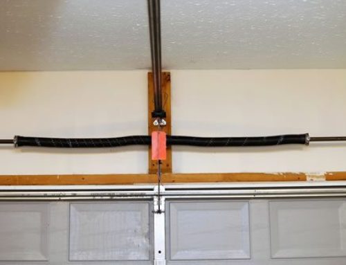 How do I now if my garage door spring needs to be replaced or repaired?